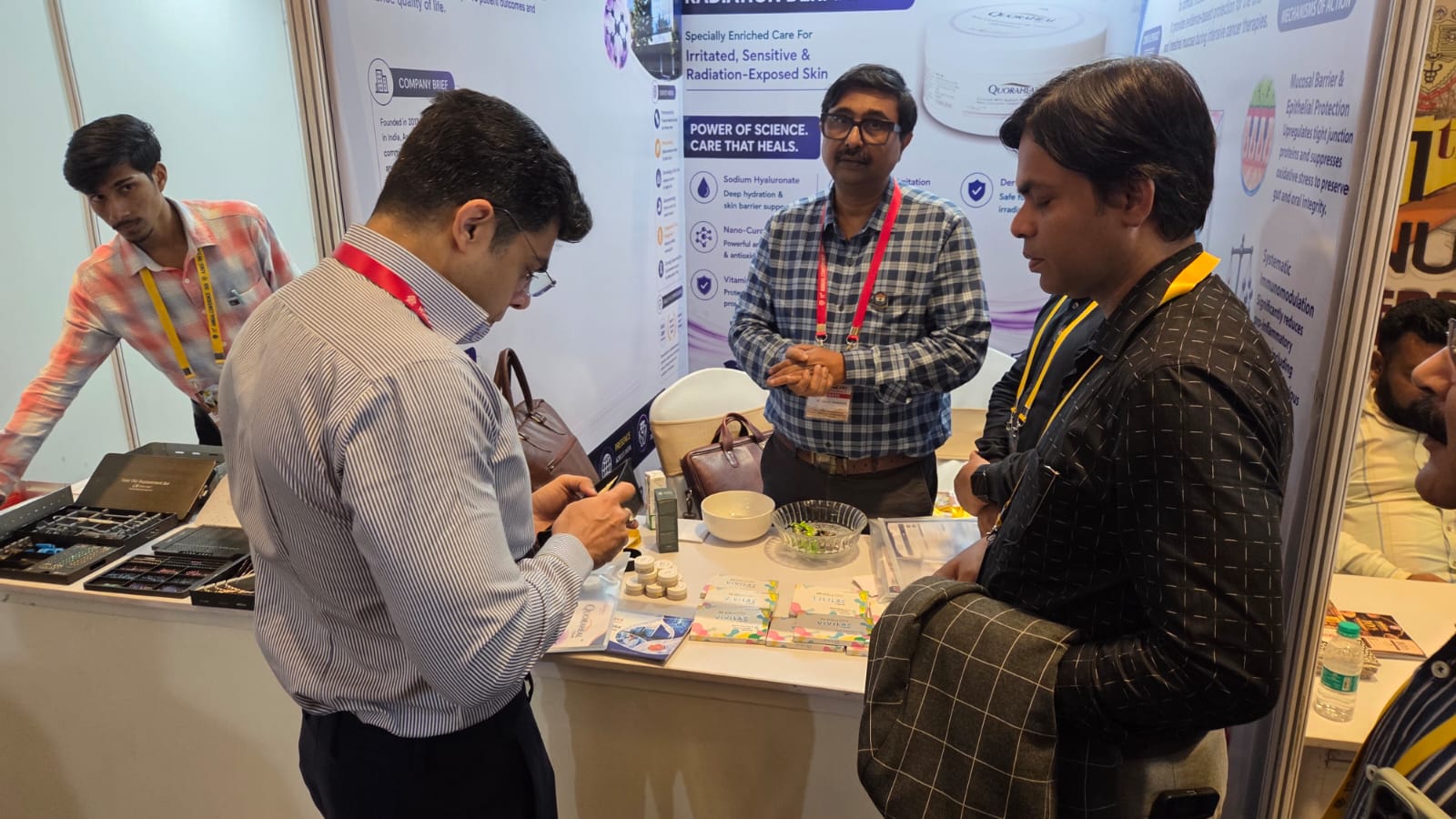 Asentus Biogenics team members interacting at the exhibition stall